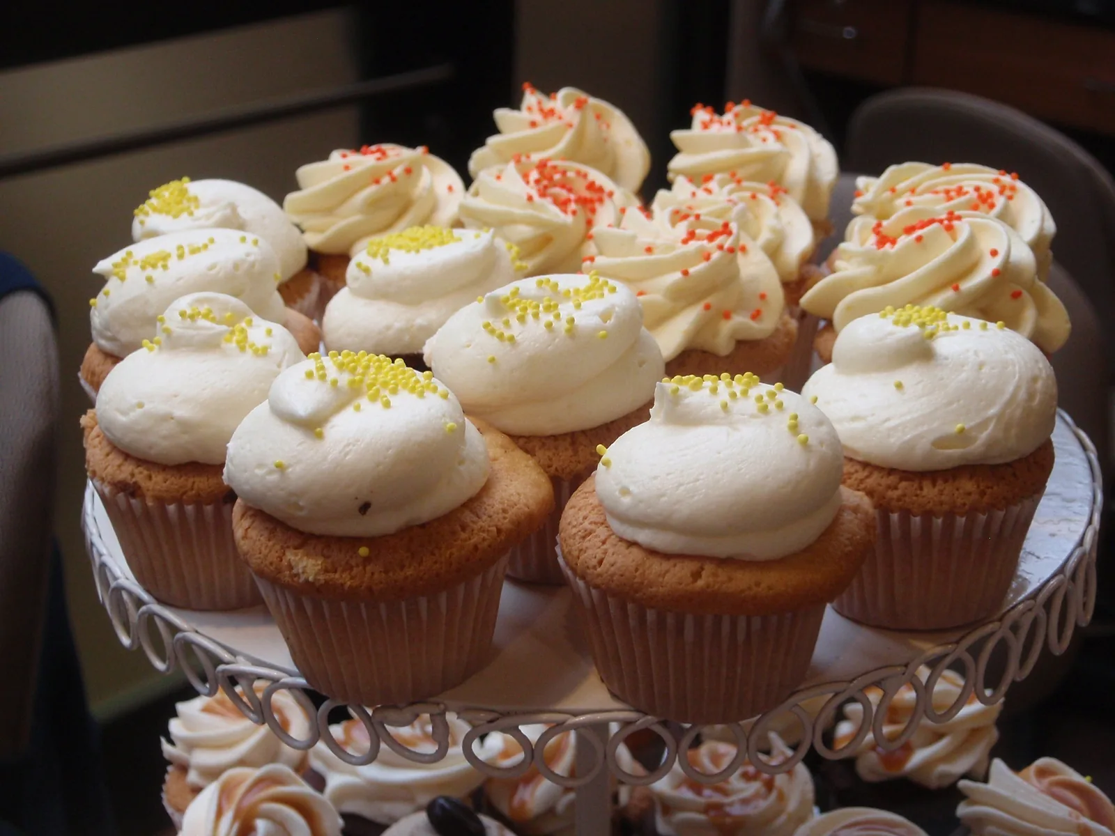 Mini cupcakes with white frosting on a cake stand. The photo was not taken in Brentwood.