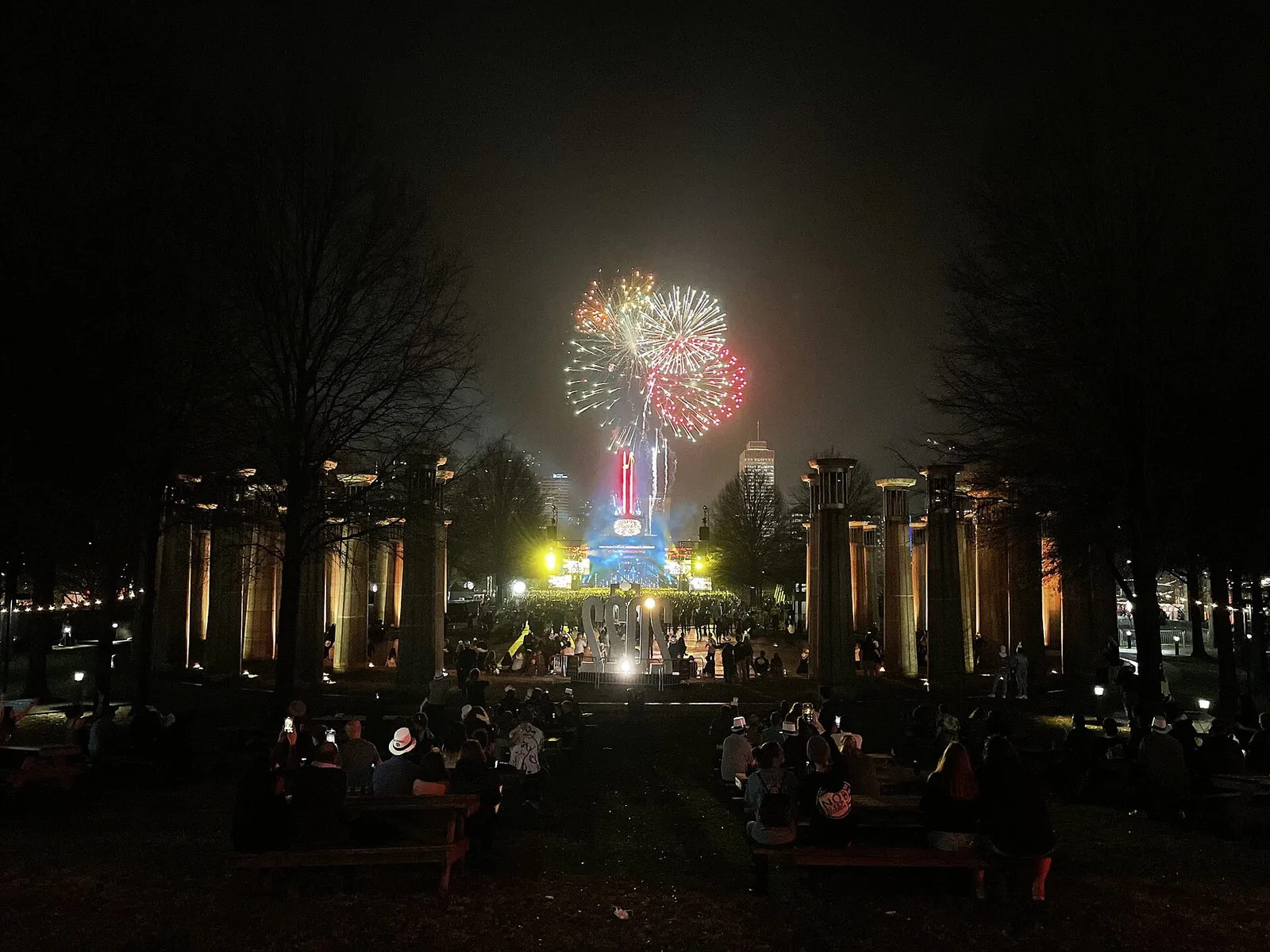 New Year's Eve fireworks over Bicentennial Capitol Mall State Park in Nashville, framed by the park's carillon columns