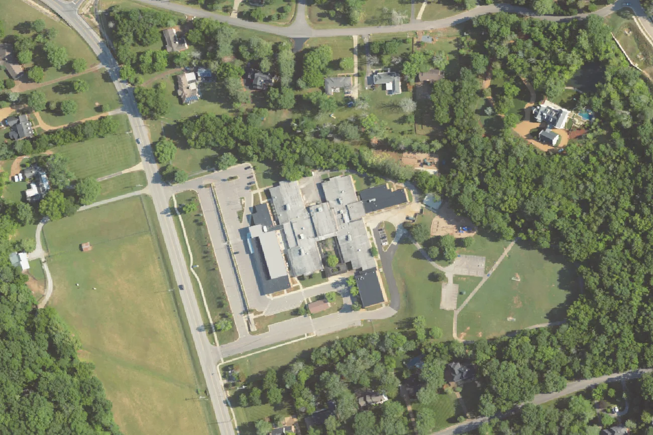 Scales Elementary School among the trees on Murray Lane in west Brentwood, seen from the air